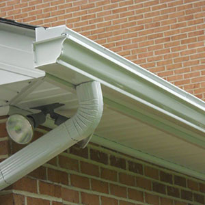 Close up of a 5-inch k-style seamless gutter system on a home